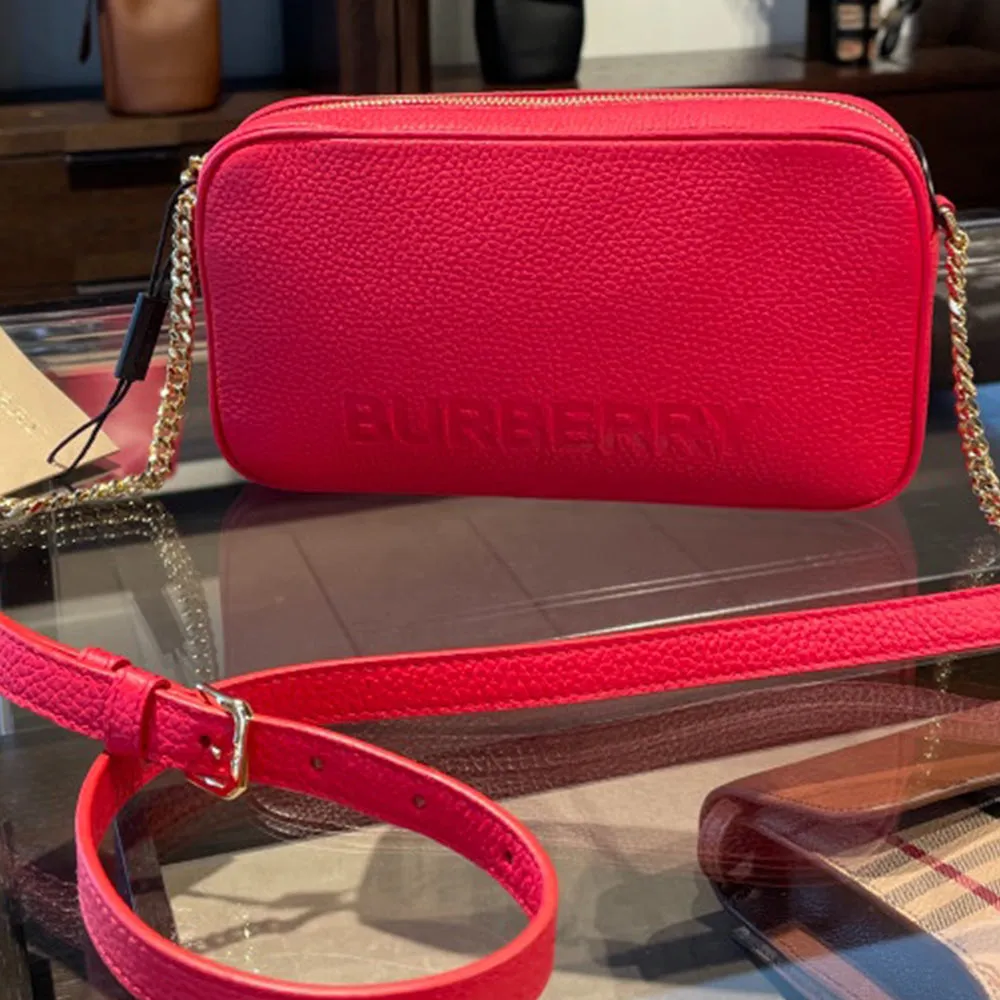 BURBERRY EMBOSSED LOGO LEATHER CROSSBODY BAG