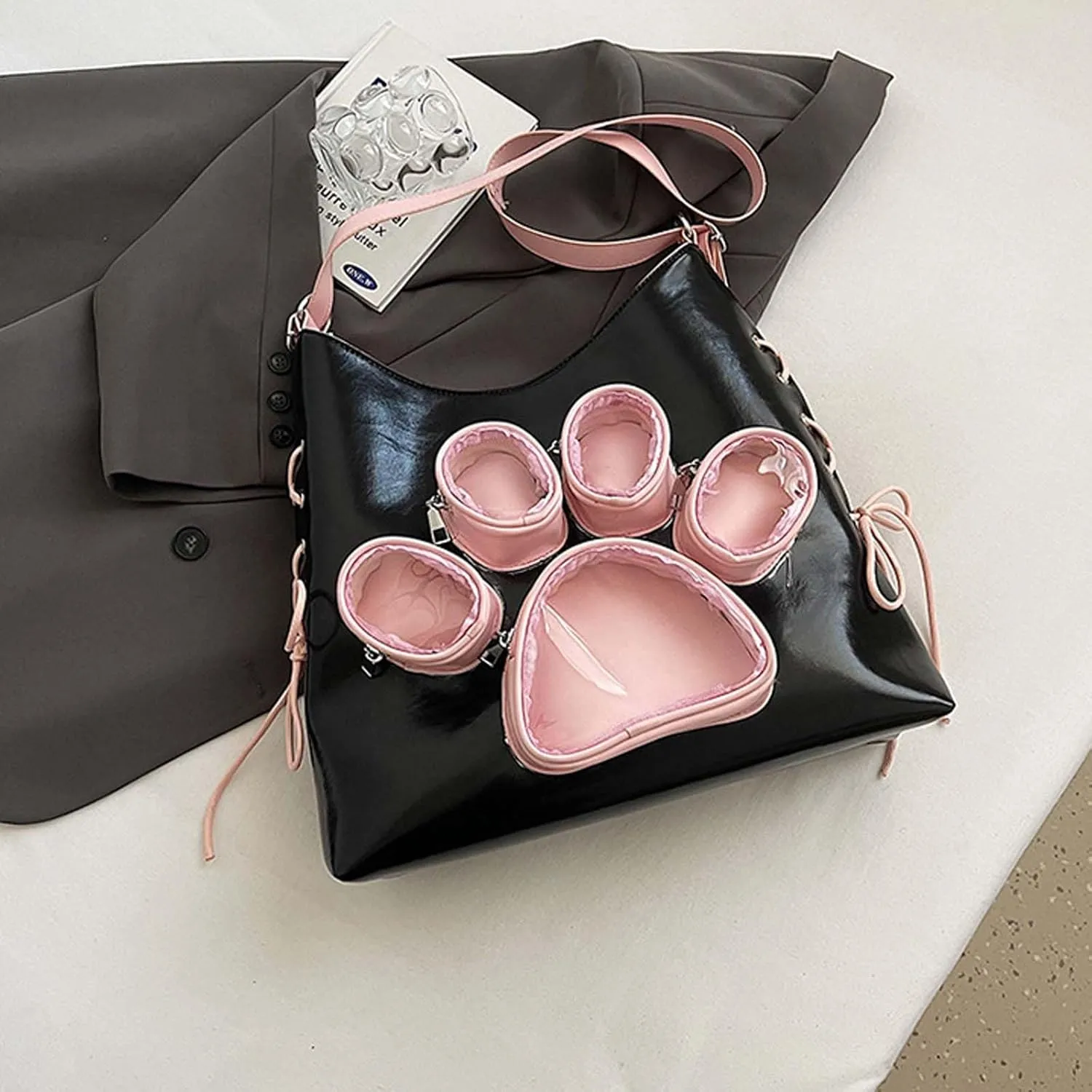 Cute cat paw shaped shoulder bag with large capacity for women, featuring a transparent doll display window